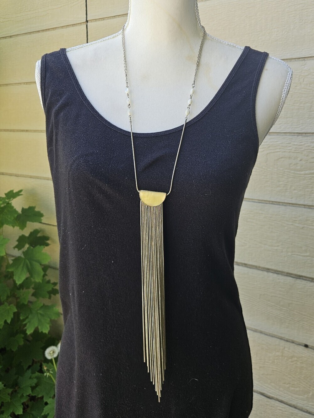 long chain necklace with yellow half moon and chain tassel